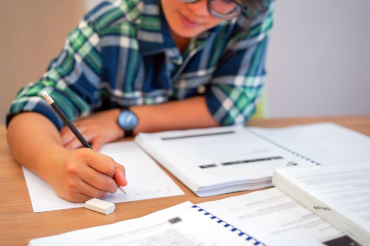 student doing bookwork